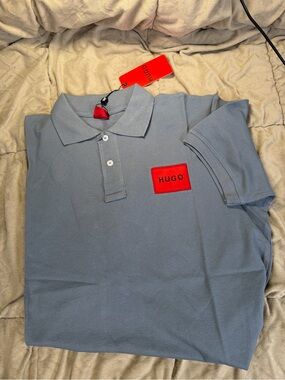 HUGO Men's Polo in Light Blue with Red Logo Patch